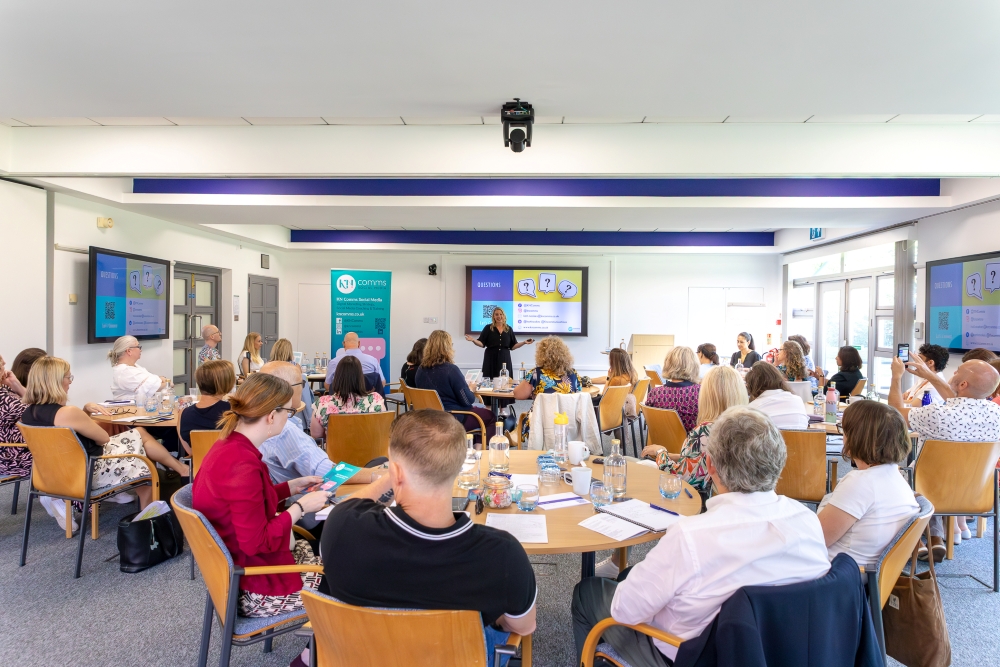 Conference delegates seated at round tables during a presentation in a fully equipped meeting room at CIM Business Centre.